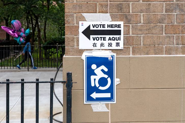 A "Vote Here" sign seen outside a polling location at Campos Plaza Community Center on first day of early voting for primaries in June 2021. Early voting for the November general election begins on October 29.